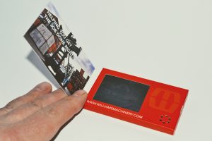LCD business card in a person's hand