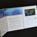 ring-bound brochure turned to video brochure